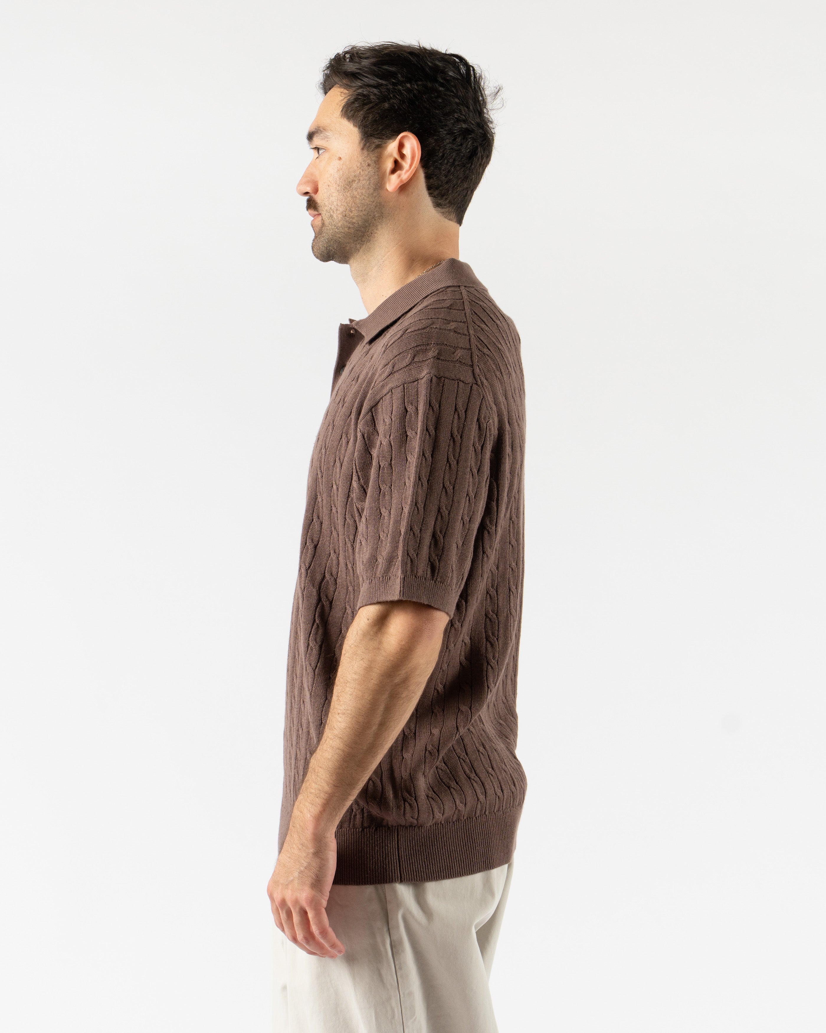 Beams Plus Cable Knit Polo in Brown – vintage-inspired short sleeve men’s polo featuring textured cable knit design, soft cotton construction, ribbed collar, and tonal buttons for a classic yet modern look.