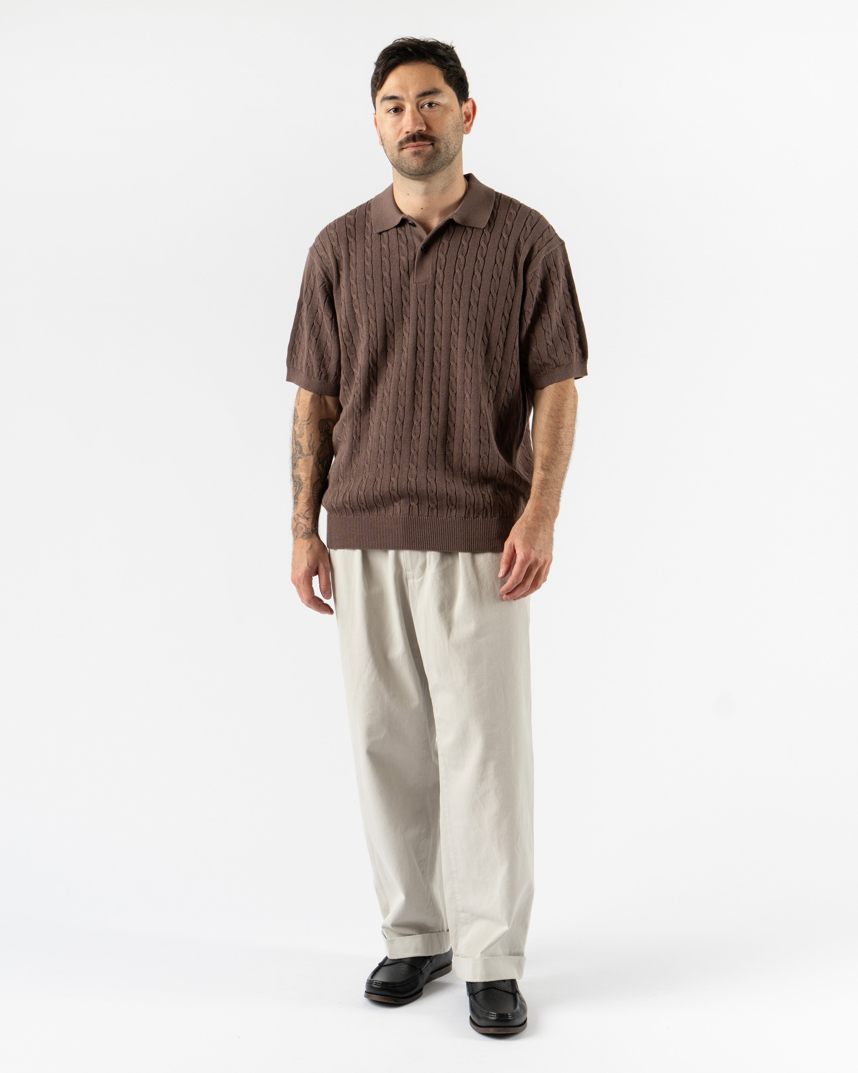 Beams Plus Cable Knit Polo in Brown – vintage-inspired short sleeve men’s polo featuring textured cable knit design, soft cotton construction, ribbed collar, and tonal buttons for a classic yet modern look.