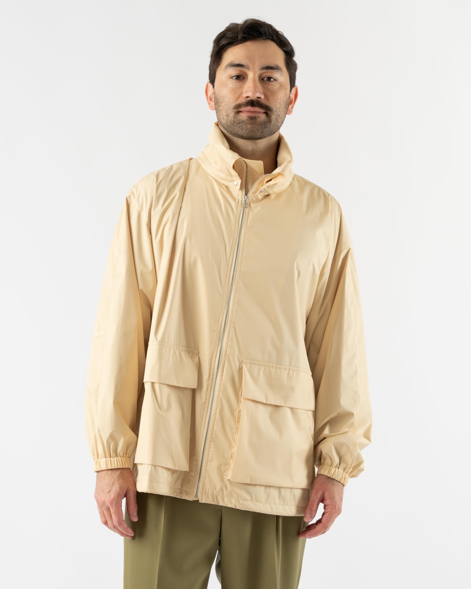 Auralee Hard Twist Polyester Satin Laminate Zip Blouson in Light Beige