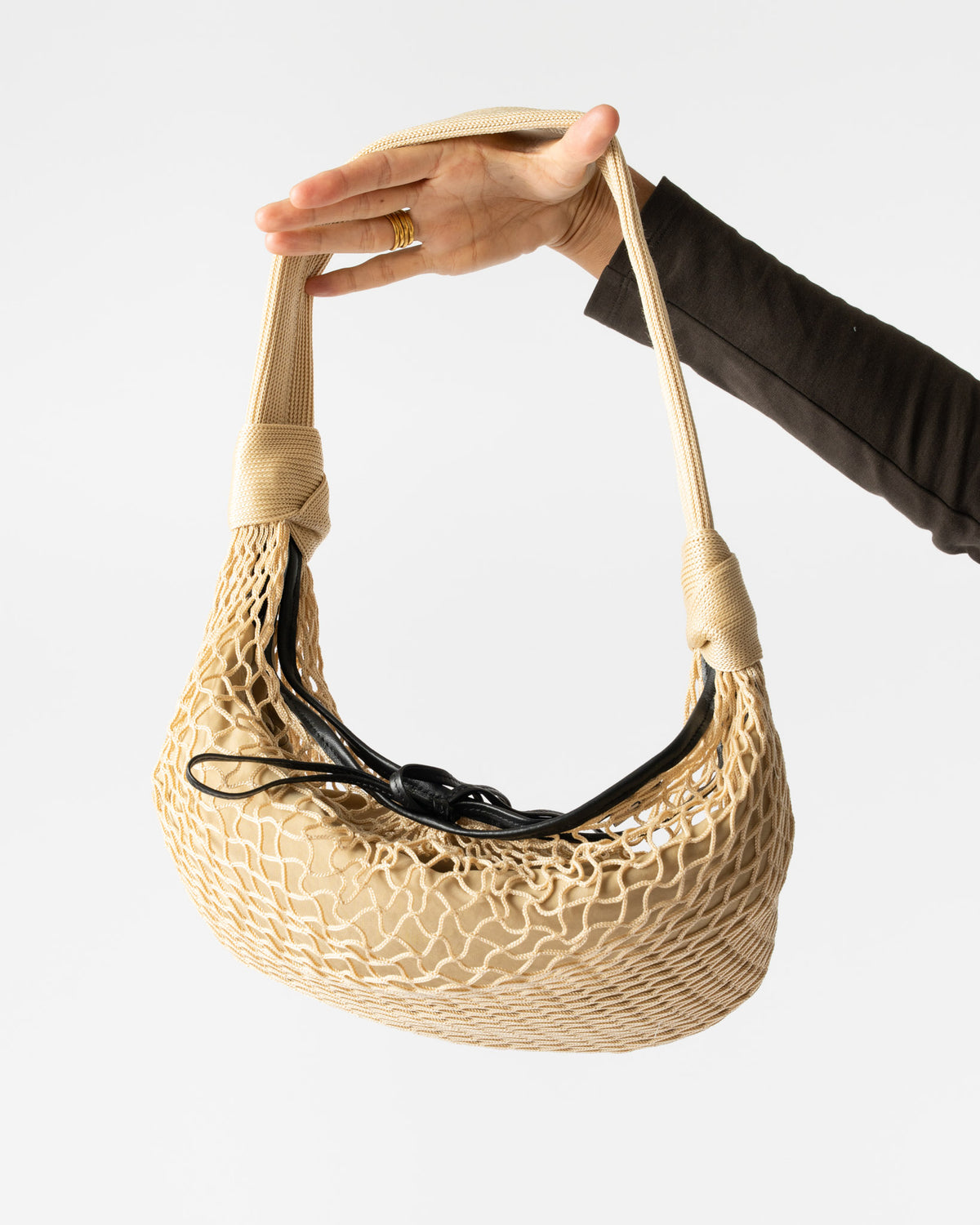 Lemaire Croissant Filt Bag in Light Beige Curated at Jake and Jones