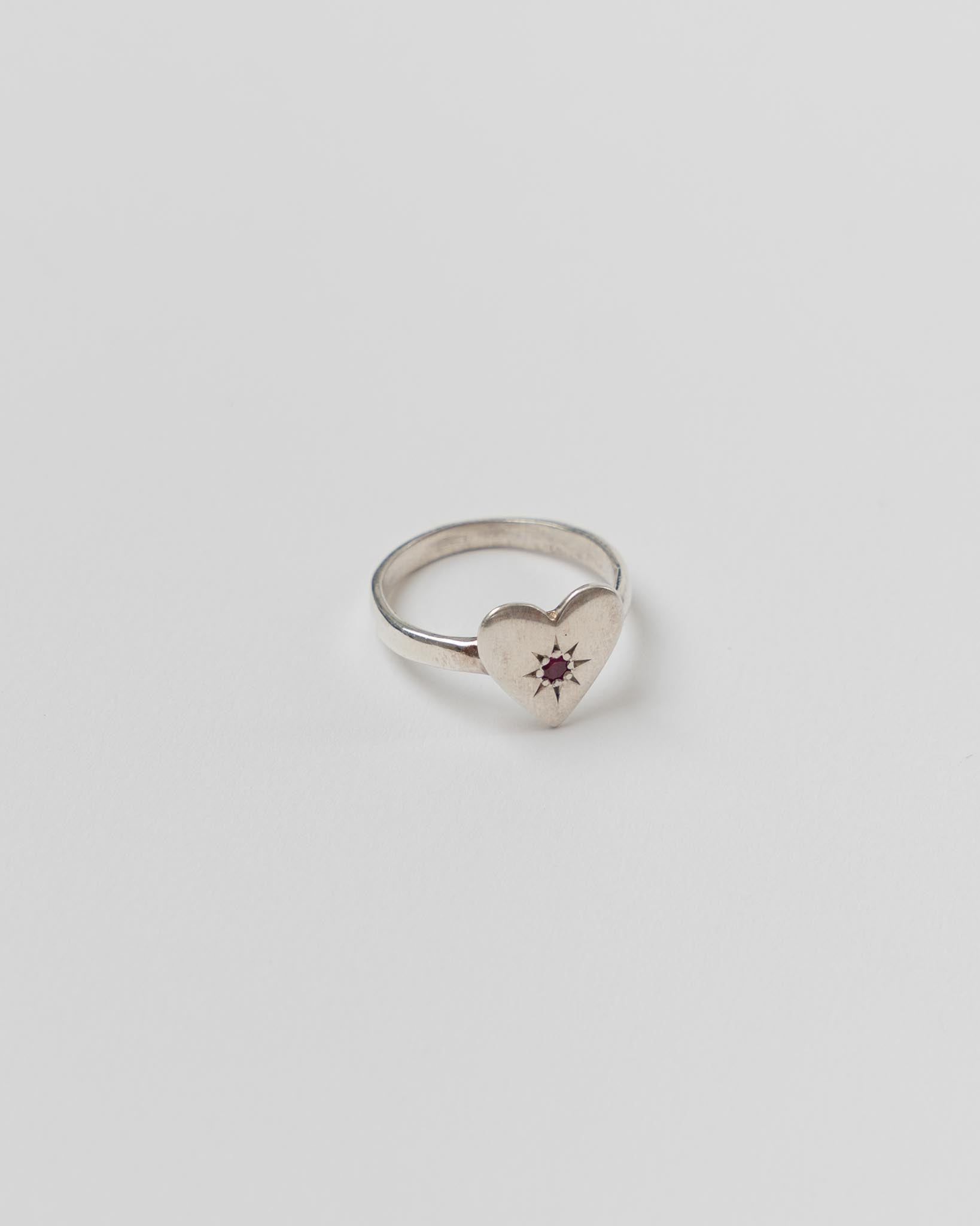 mondo-mondo-heart-ring-with-star-engraving-in-sterling-silver-and-ruby-jake-and-jones-santa-barbara-boutique-curated-designer-fashion-slow-fashion