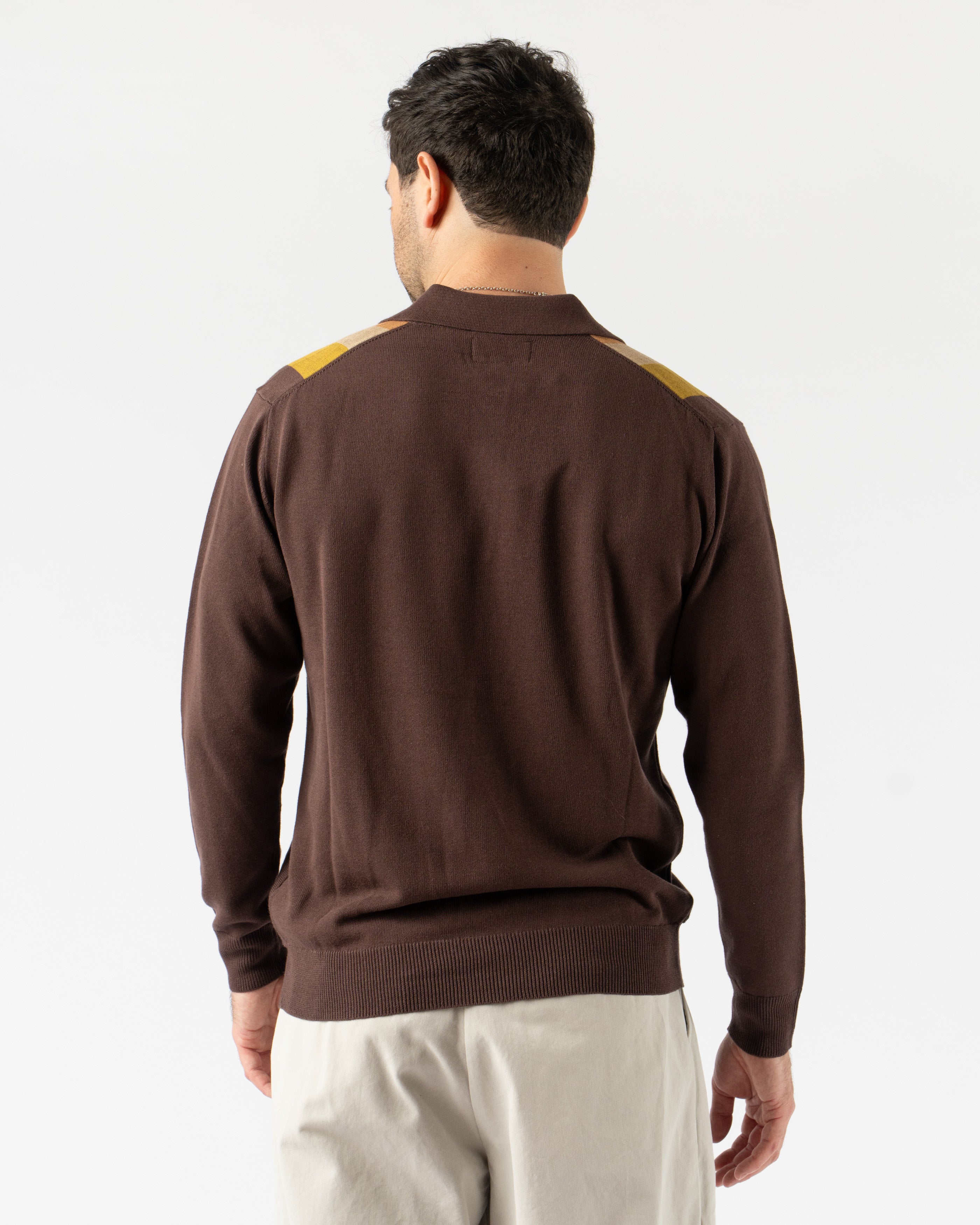  Beams Plus Argyle Knit Polo in Dark Brown Stripe – retro-inspired short sleeve polo featuring a bold argyle and stripe knit pattern, soft cotton construction, ribbed collar and cuffs, and a button-up placket for vintage charm with modern flair.