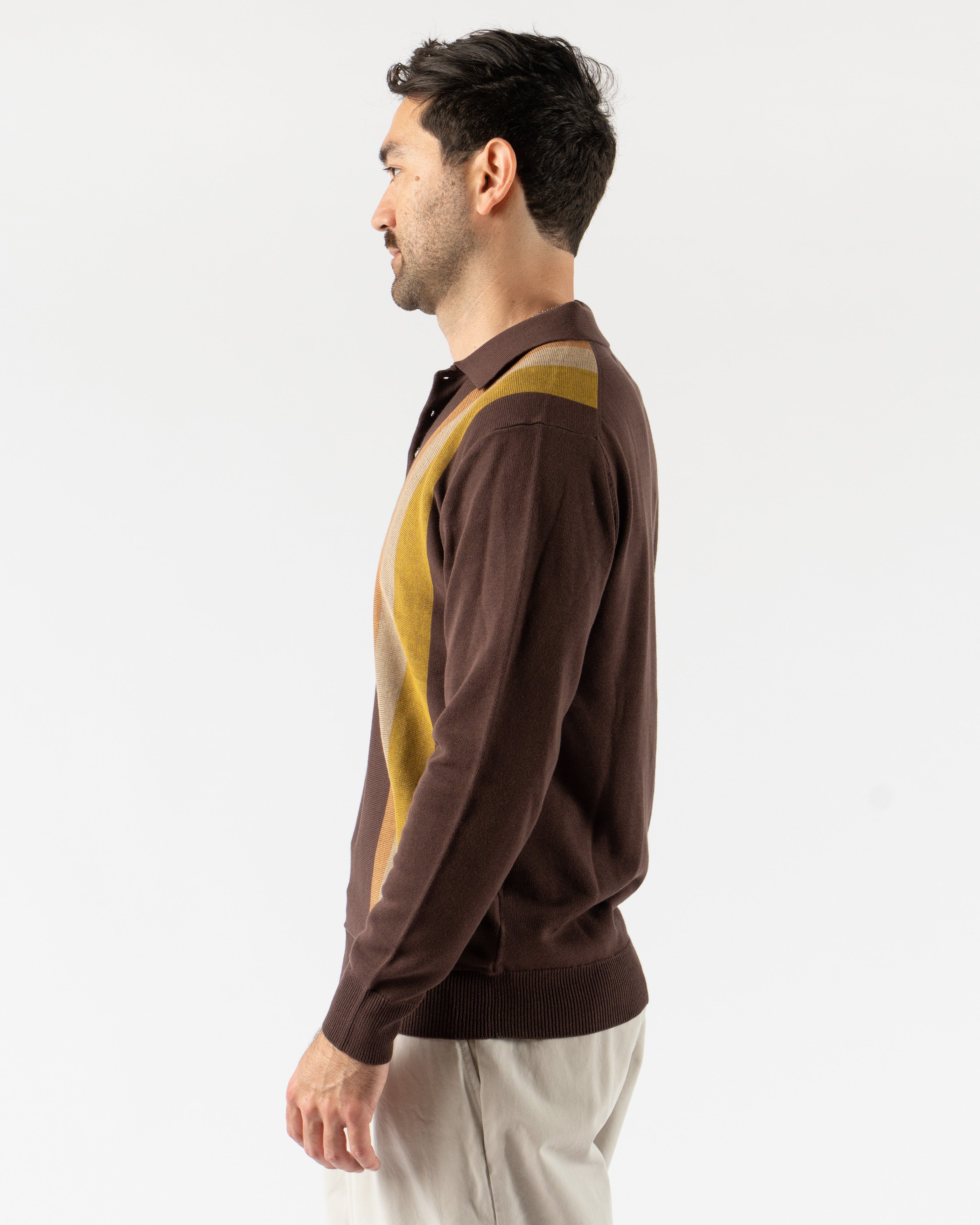  Beams Plus Argyle Knit Polo in Dark Brown Stripe – retro-inspired short sleeve polo featuring a bold argyle and stripe knit pattern, soft cotton construction, ribbed collar and cuffs, and a button-up placket for vintage charm with modern flair.