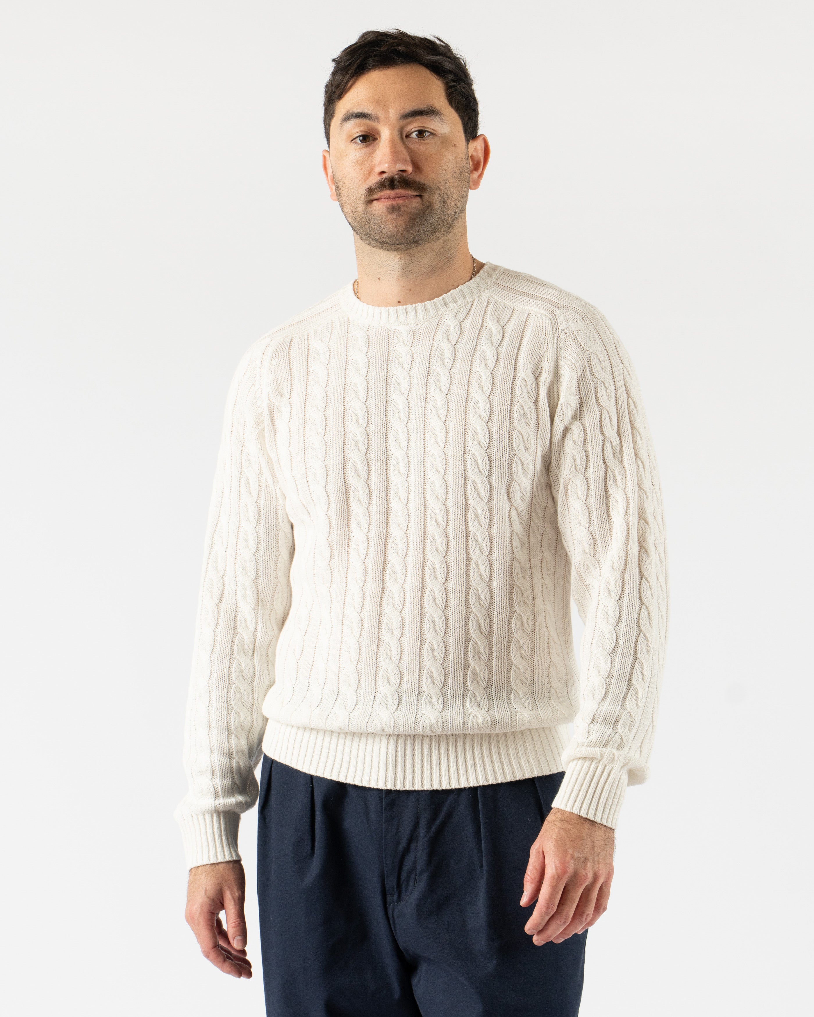 Beams Plus Cable Knit Crewneck in Cotton Linen White – classic crewneck sweater featuring a textured cable knit design, made from a breathable cotton-linen blend with ribbed cuffs and hem, perfect for lightweight layering in a crisp white tone.