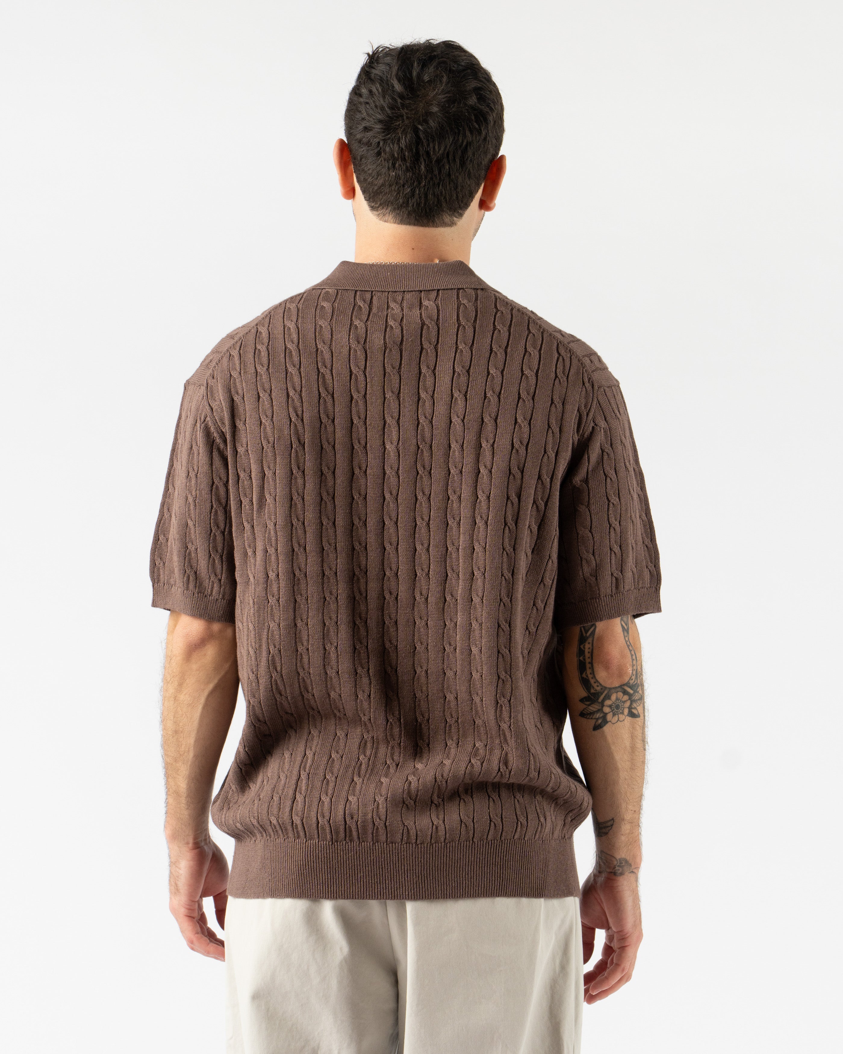 Beams Plus Cable Knit Polo in Brown – vintage-inspired short sleeve men’s polo featuring textured cable knit design, soft cotton construction, ribbed collar, and tonal buttons for a classic yet modern look.