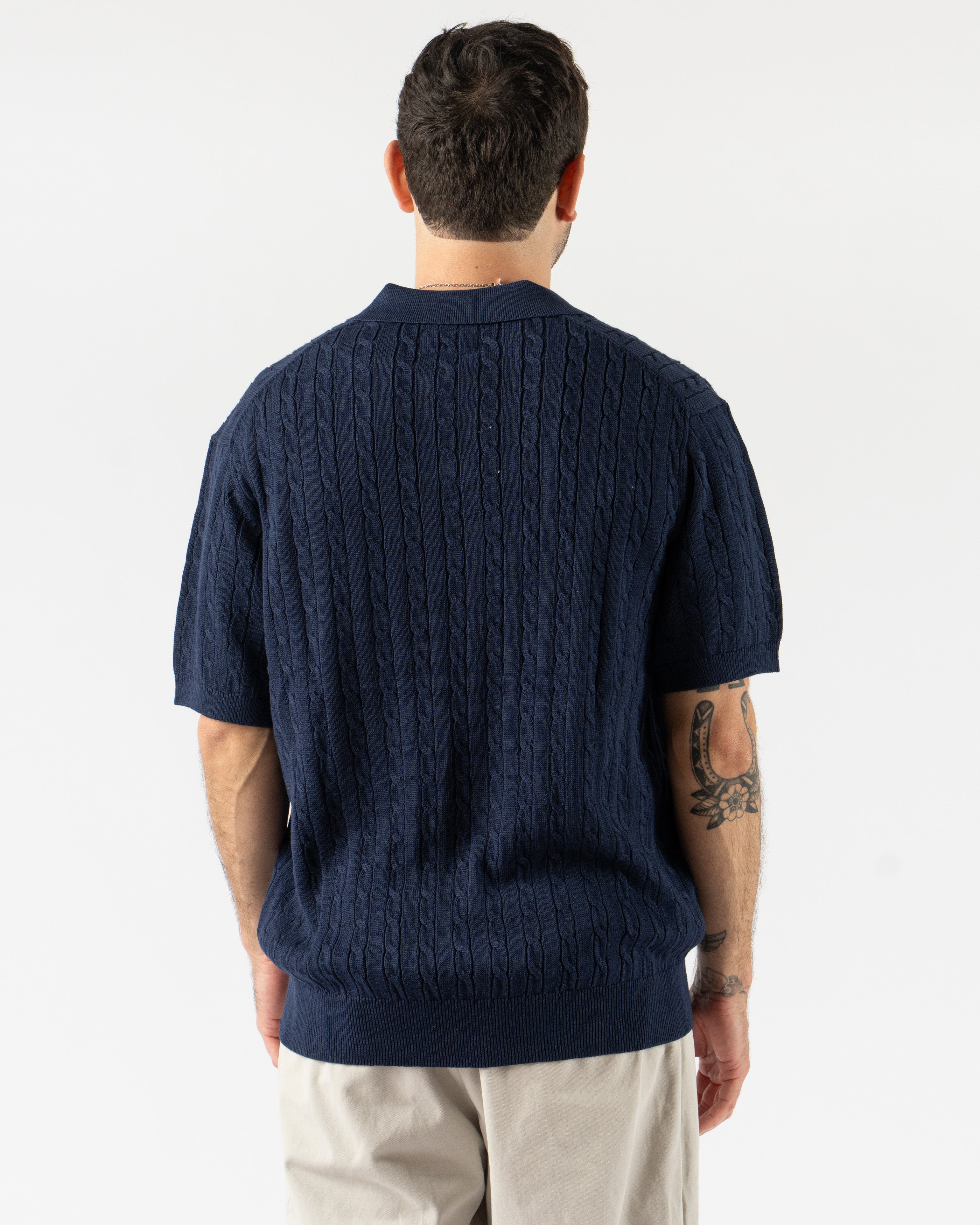 Beams Plus Cable Knit Polo in Navy – timeless men’s short sleeve polo with a textured cable knit pattern, crafted from soft cotton with a ribbed collar and tonal buttons for a refined, vintage-inspired style.