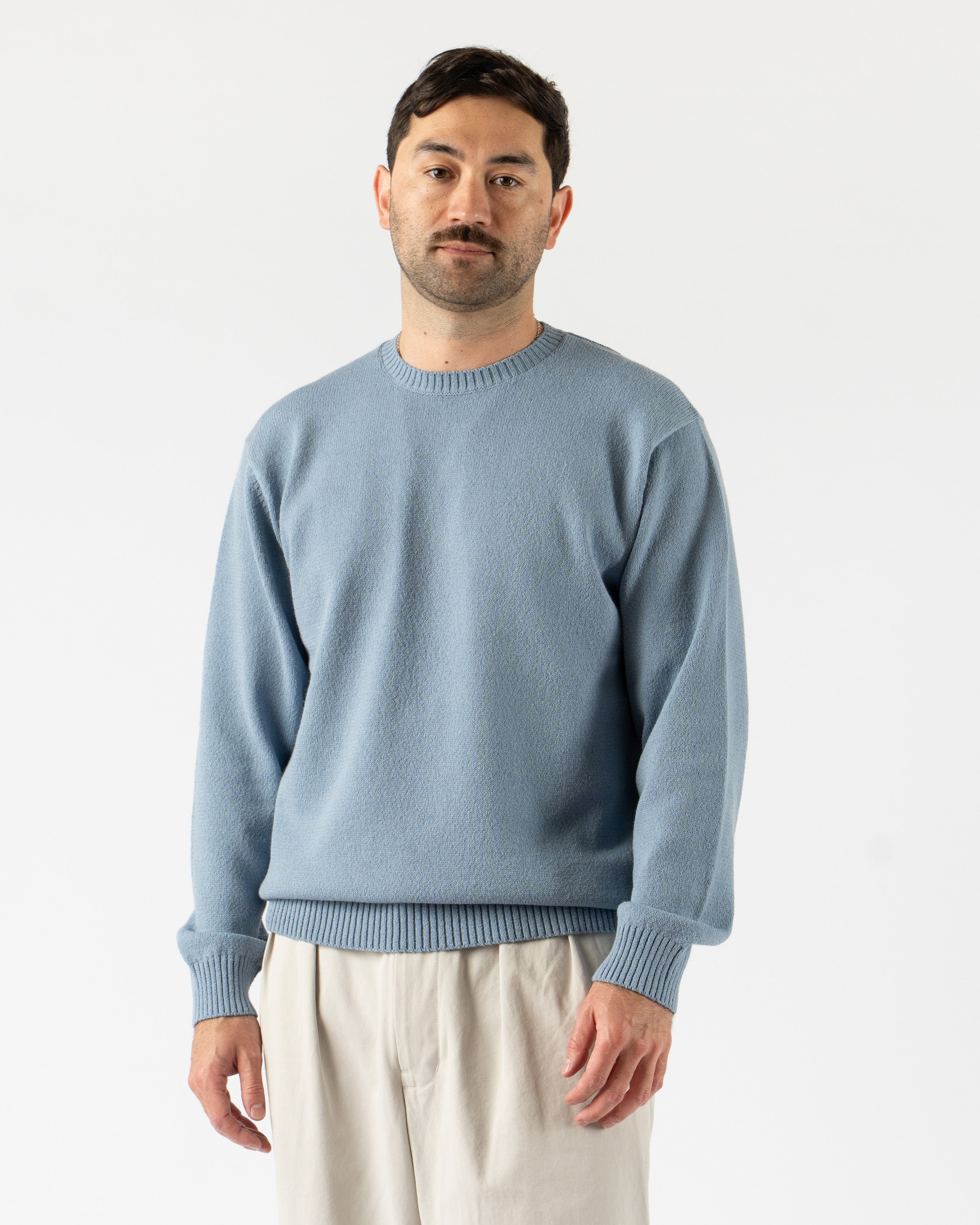 Beams Plus Crewneck in 7-Gauge Lily Yarn Sax – lightweight crewneck sweater made from soft lily yarn in a 7-gauge knit, featuring a smooth texture, ribbed cuffs and hem, and a fresh sax blue hue for a clean, seasonal staple.