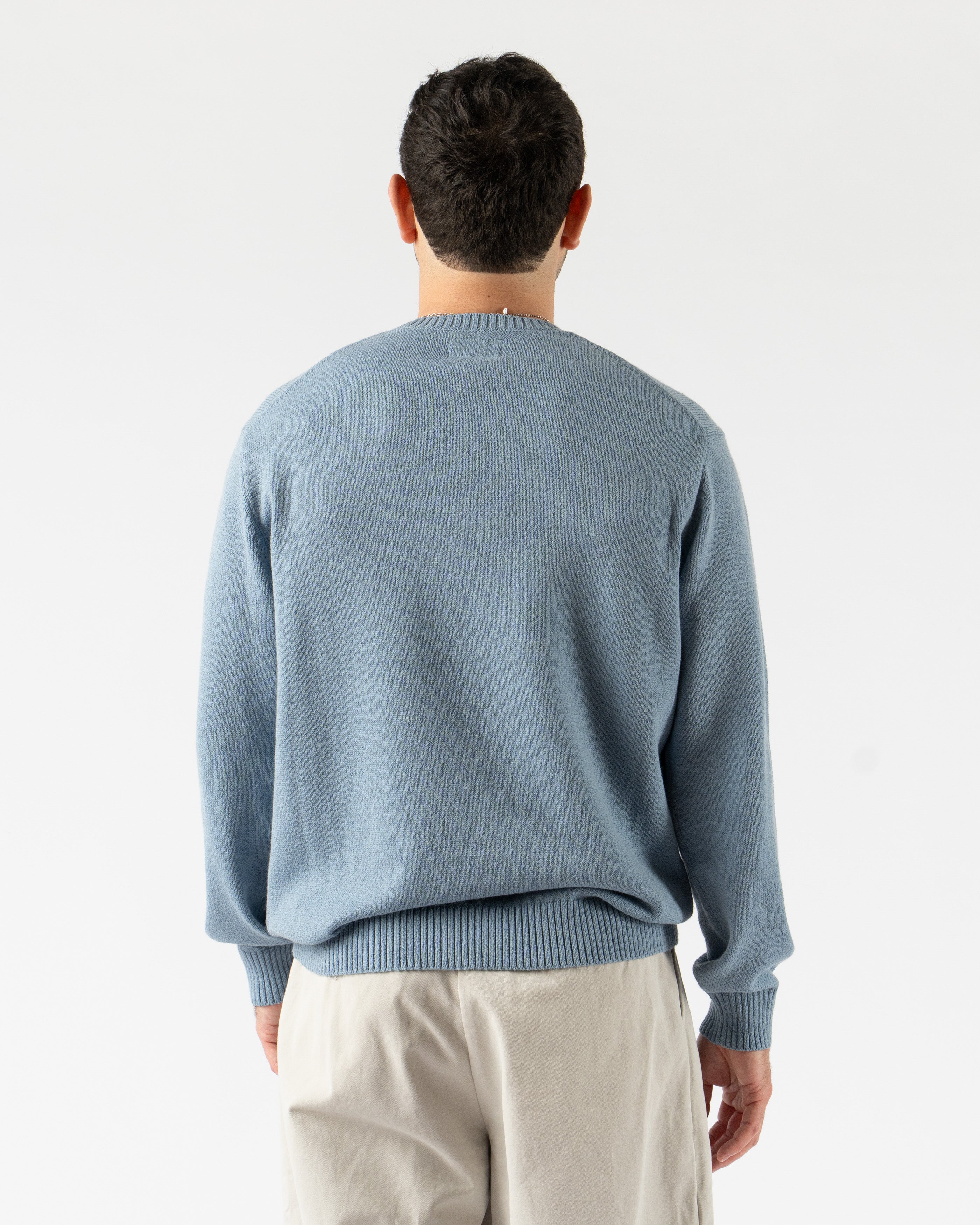 Beams Plus Crewneck in 7-Gauge Lily Yarn Sax – lightweight crewneck sweater made from soft lily yarn in a 7-gauge knit, featuring a smooth texture, ribbed cuffs and hem, and a fresh sax blue hue for a clean, seasonal staple.