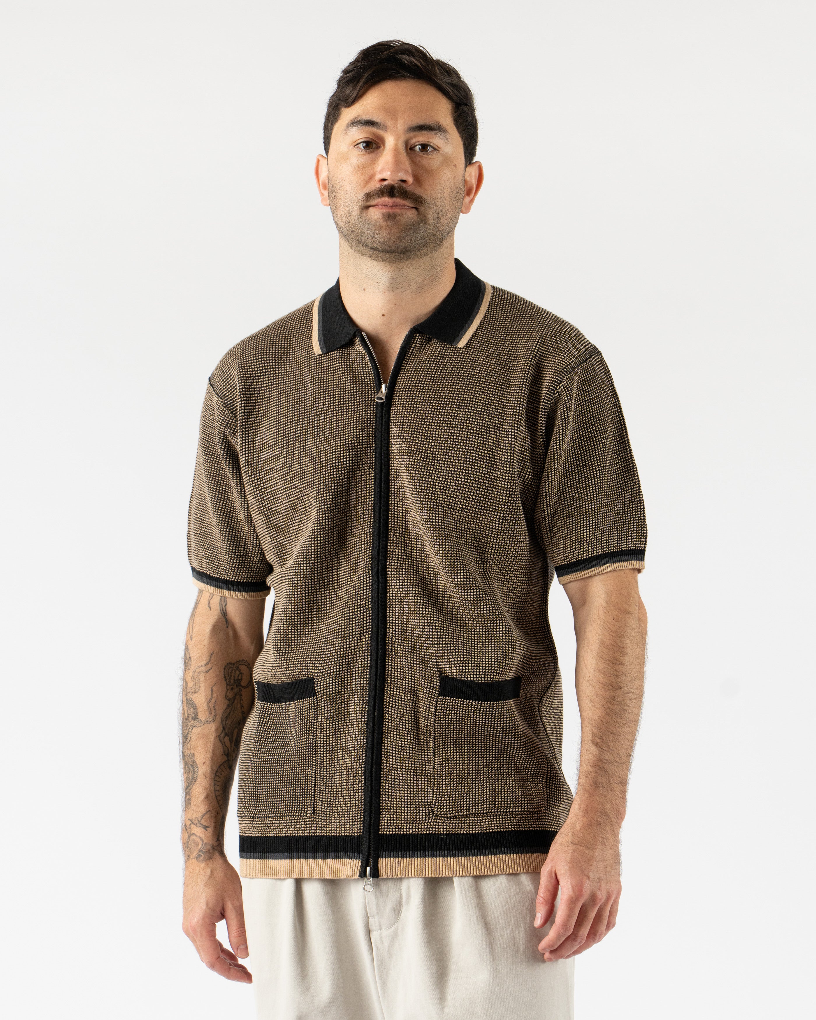 Beams Plus Zip Knit Polo in Black – modern short sleeve men’s polo featuring a sleek zip-up front, fine knit construction, and ribbed collar and hems for a clean, contemporary silhouette