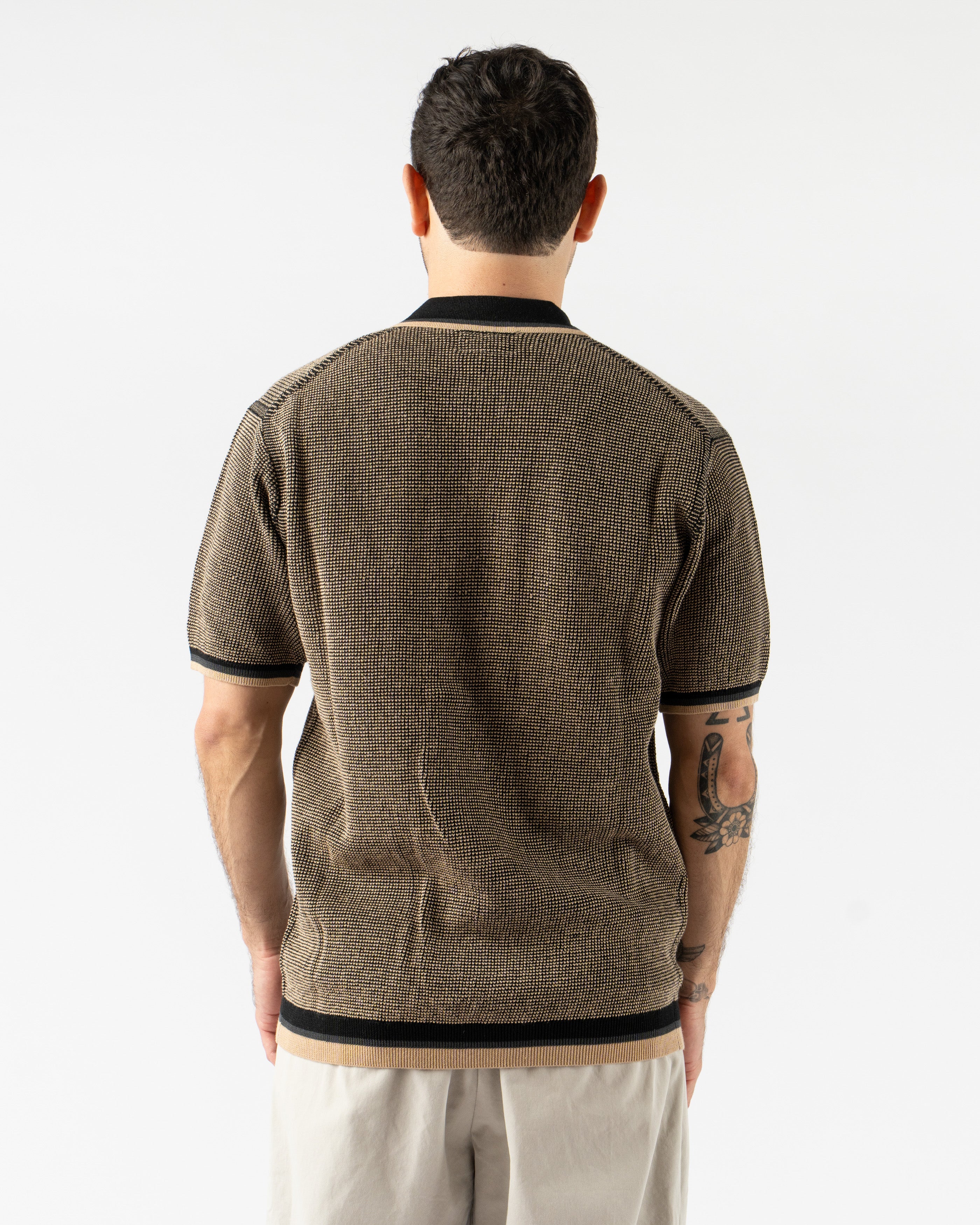 Beams Plus Zip Knit Polo in Black – modern short sleeve men’s polo featuring a sleek zip-up front, fine knit construction, and ribbed collar and hems for a clean, contemporary silhouette