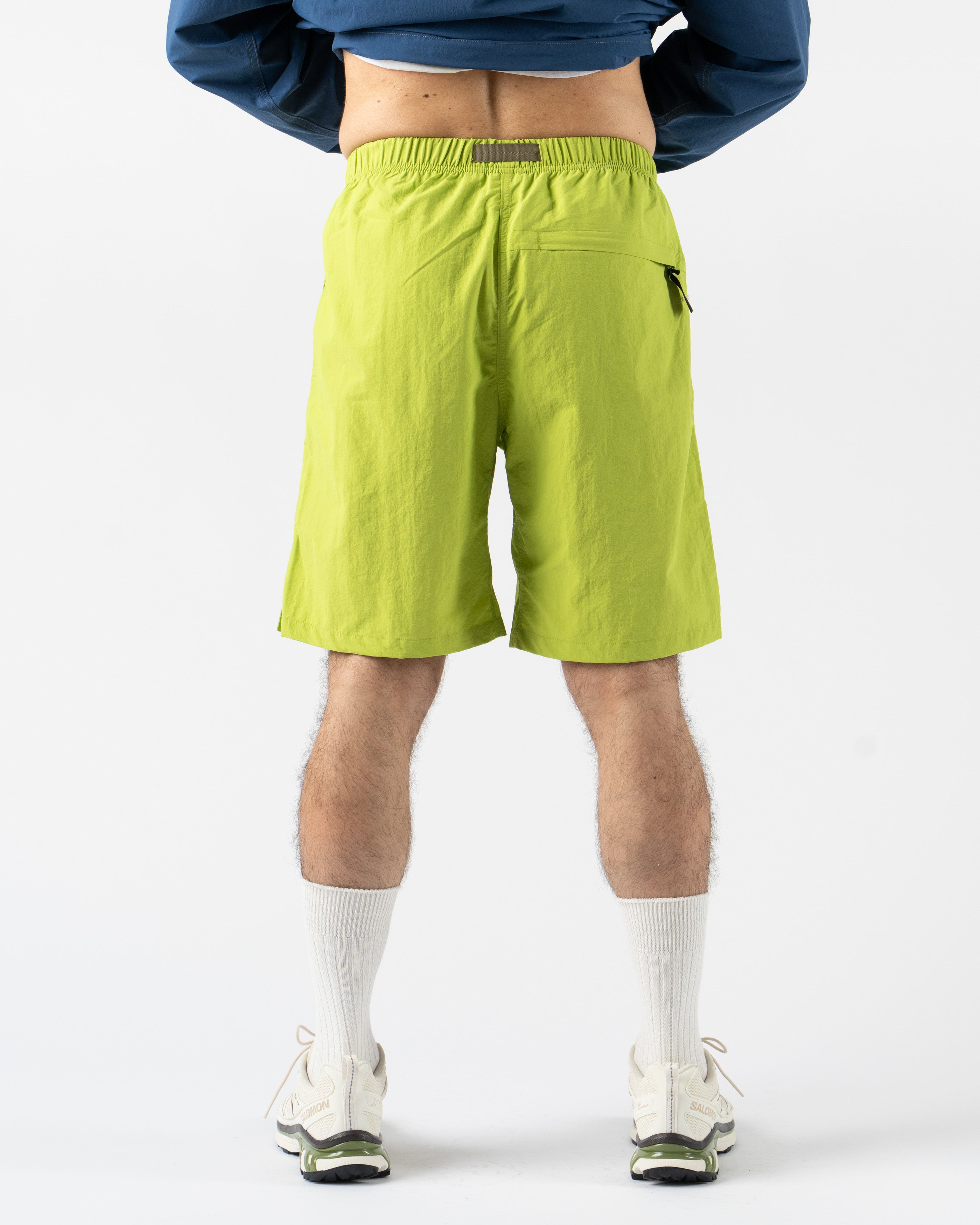 Gramicci Nylon G-Short in Kiwi laid flat showing elastic waistband and integrated belt