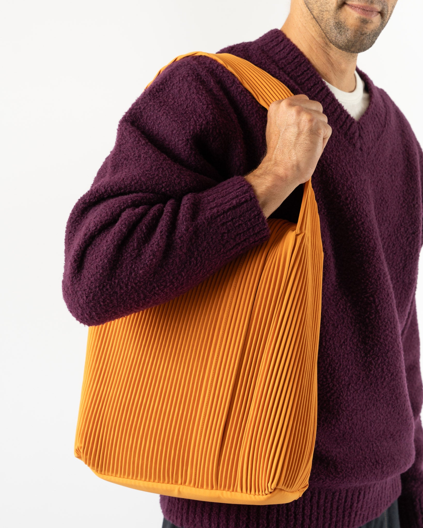 Homme Plissé Issey Miyake Rounded Square Bag in Orpiment Orange