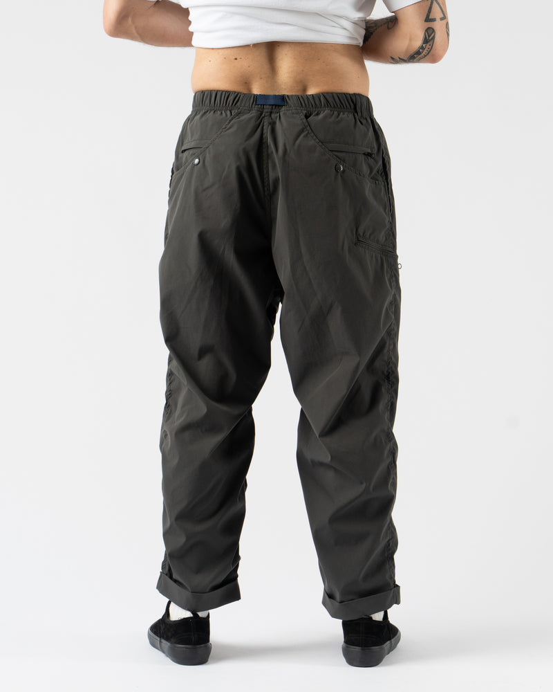 Pilgrim Surf + Supply Salathe Climbing Pant in Charcoal shown from multiple angles, crafted from recycled polyester with a relaxed, tapered fit, elastic waistband, and articulated knees. Featuring durable construction, minimal branding, and technical design details ideal for climbing, travel, or everyday wear in a versatile charcoal grey.