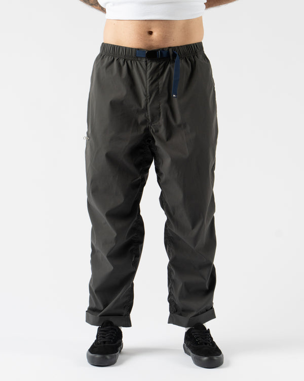 Pilgrim Surf + Supply Salathe Climbing Pant in Charcoal shown from multiple angles, crafted from recycled polyester with a relaxed, tapered fit, elastic waistband, and articulated knees. Featuring durable construction, minimal branding, and technical design details ideal for climbing, travel, or everyday wear in a versatile charcoal grey.