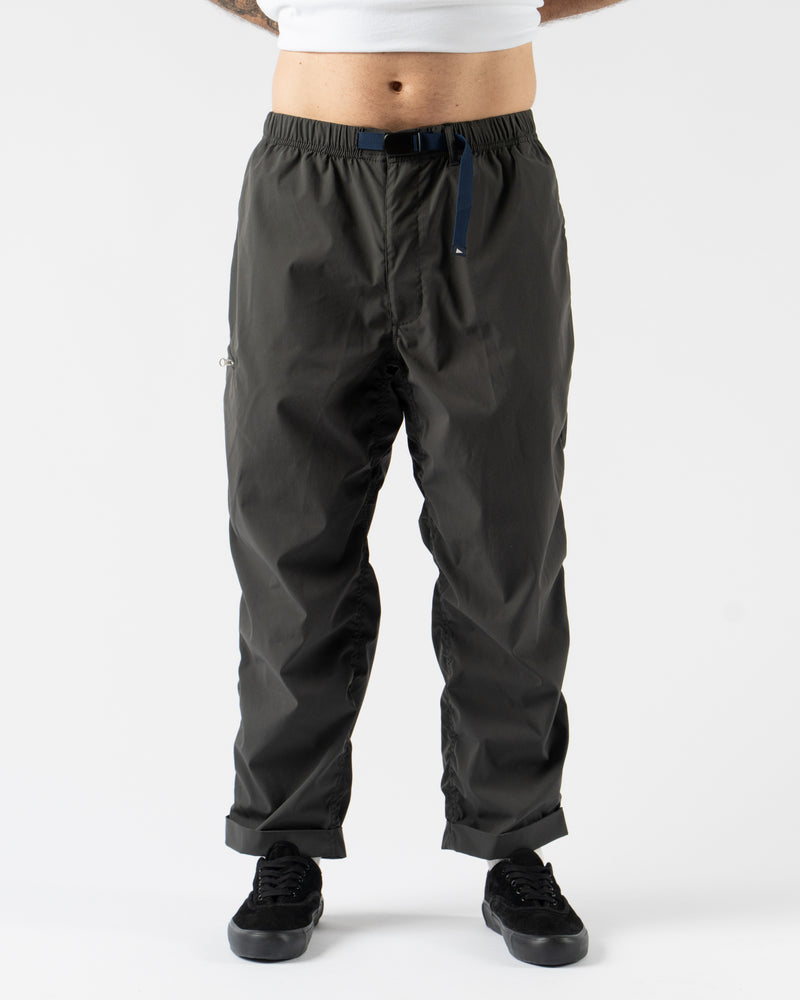 Pilgrim Surf + Supply Salathe Climbing Pant in Charcoal shown from multiple angles, crafted from recycled polyester with a relaxed, tapered fit, elastic waistband, and articulated knees. Featuring durable construction, minimal branding, and technical design details ideal for climbing, travel, or everyday wear in a versatile charcoal grey.
