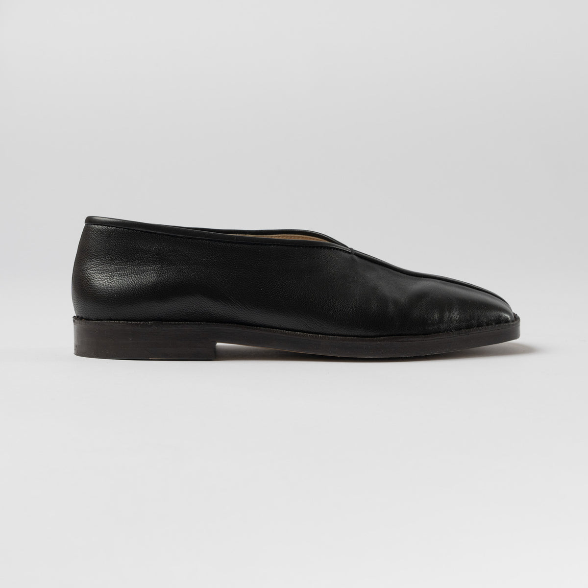 Lemaire Flat Piped Slippers in Black Curated at Jake and Jones