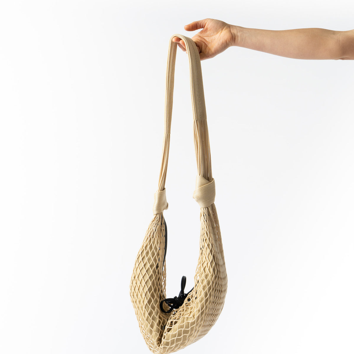 Lemaire Light Beige Croissant Filt Bag Curated at Jake and Jones