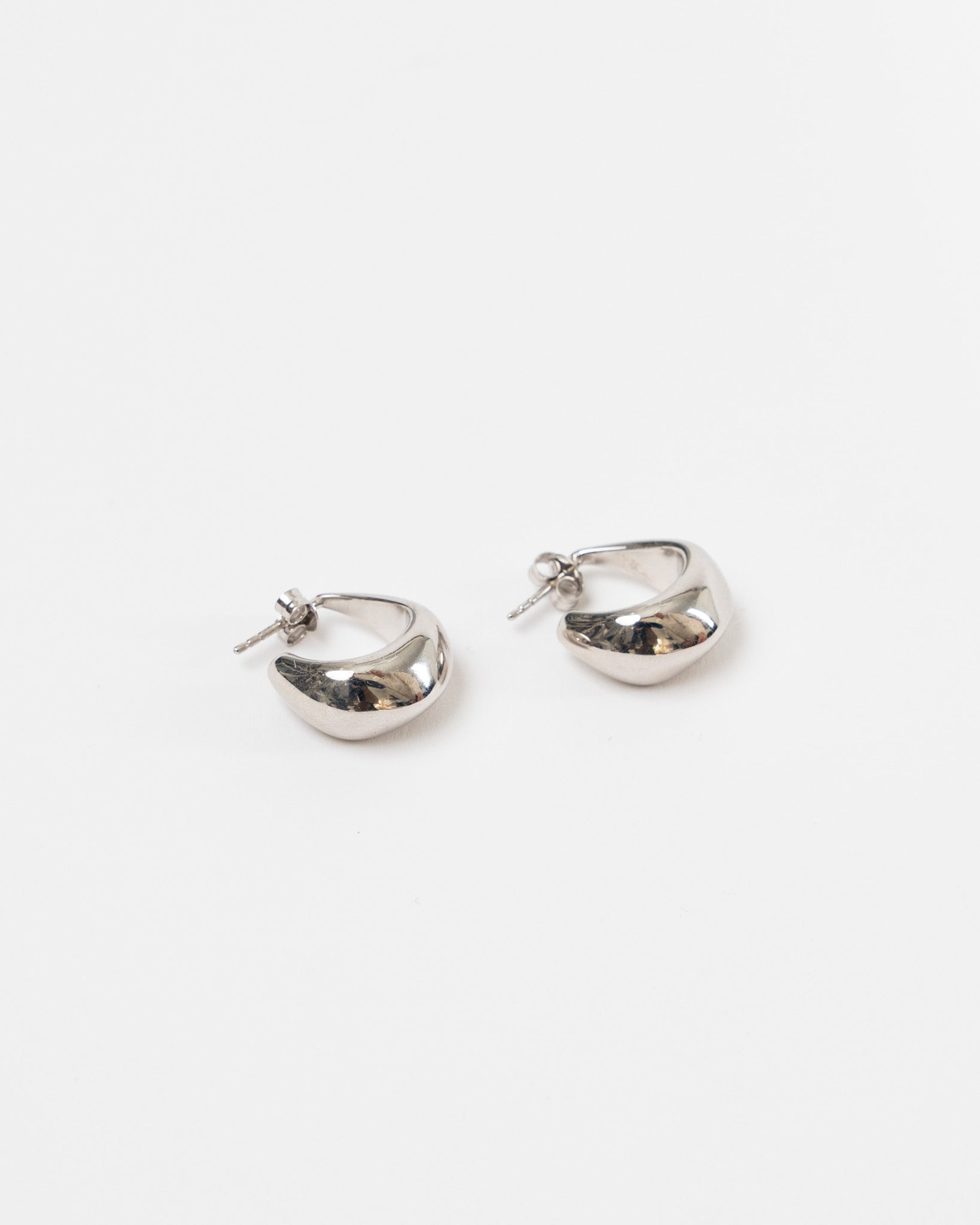 Lemaire Curved Mini Drop Hoops in Silver