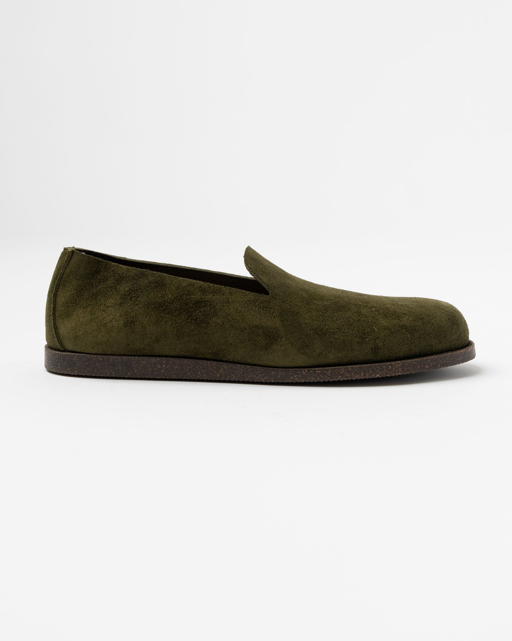 A tosca olive colored Yuketen slip-on loafer on a white background.