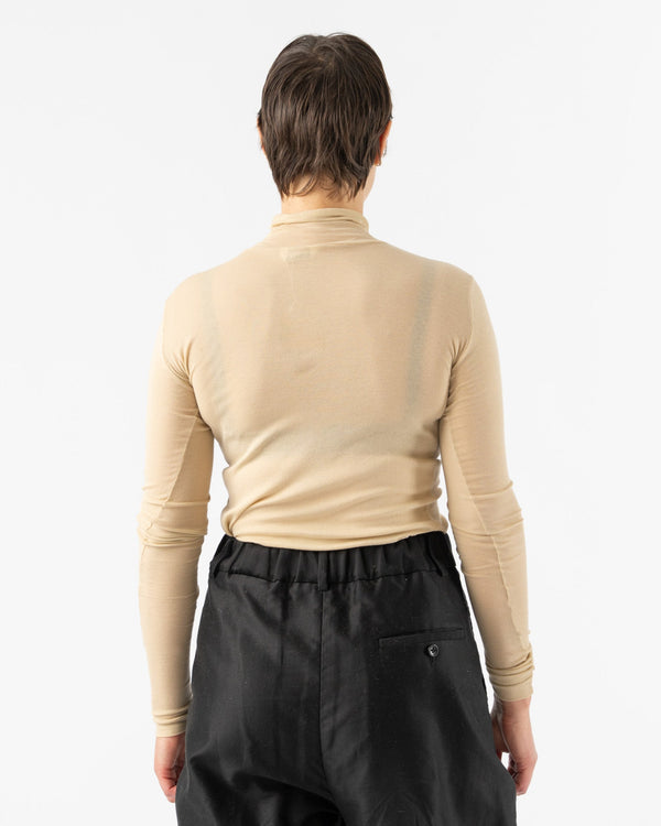 Auralee-High-Gauge-Sheer-Rib-Turtleneck-in-Light-Beige-Santa-Barbara-Boutique-Jake-and-Jones-Sustainable-Fashion