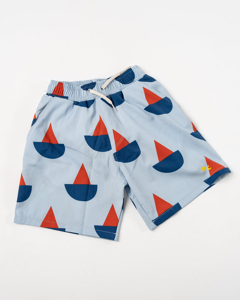 bobo-choses-kids-sail-boat-all-over-swim-bermuda-shorts-ss23-jake-and-jones-a-santa-barbara-boutique