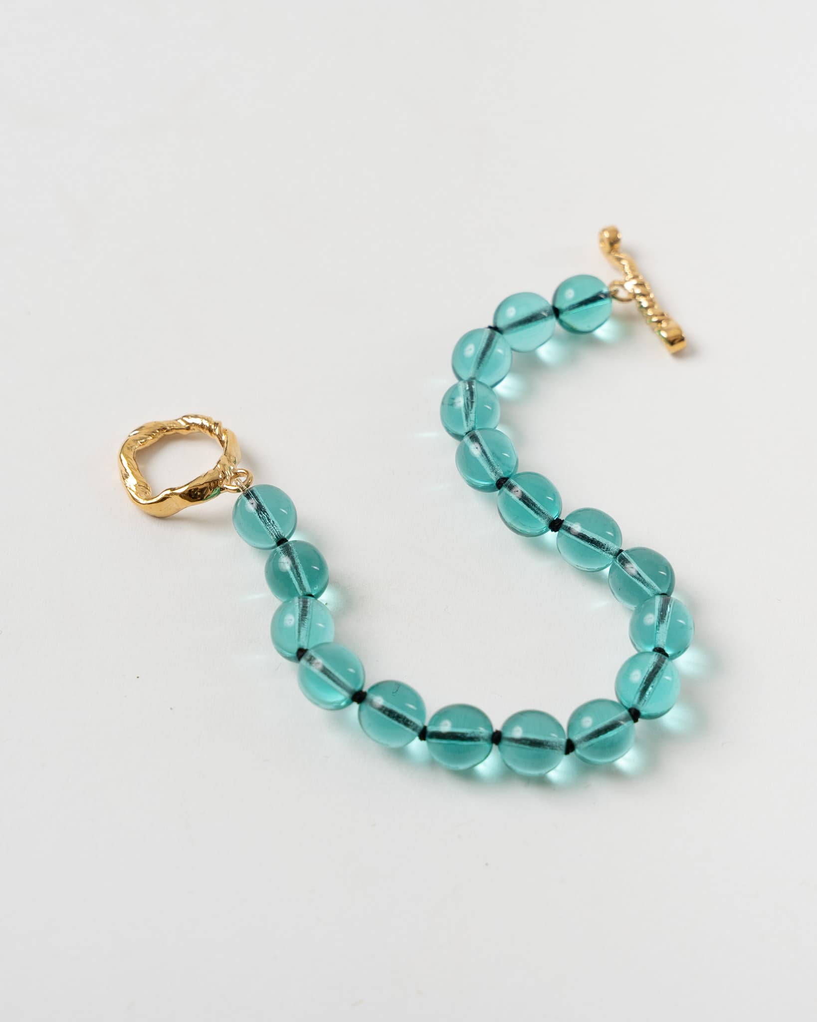 mondo-mondo-nan-bracelet-in-teal-glass-fw22